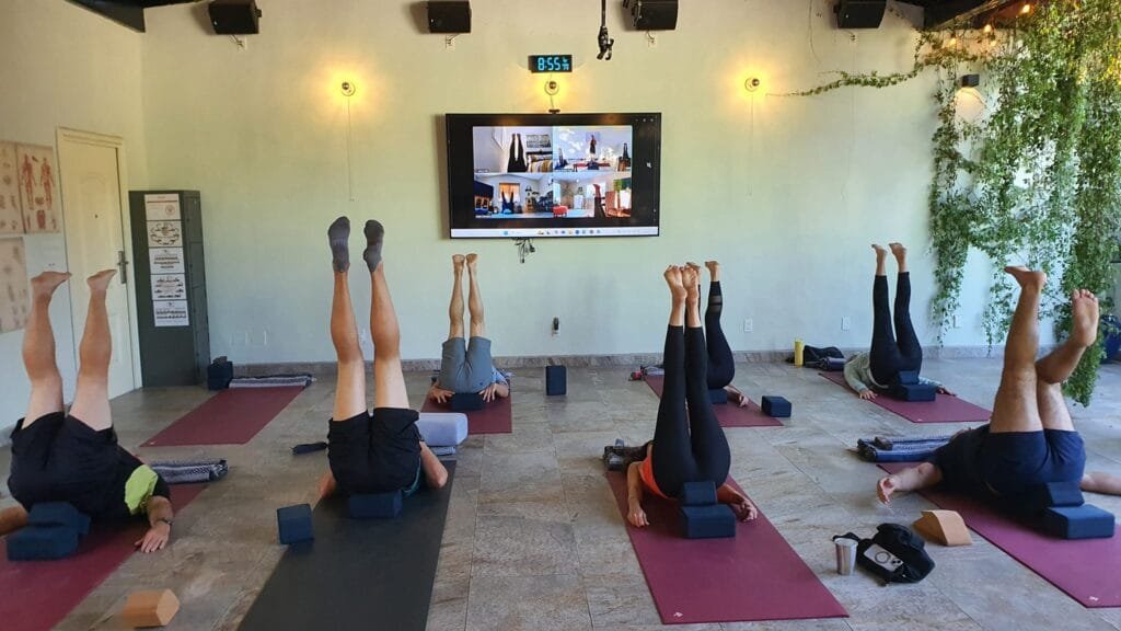 Legs up group Simultaneous Virtual and Studio Yoga Class in The Vallarta Breeze Yoga Puerto Vallarta Yoga Studio