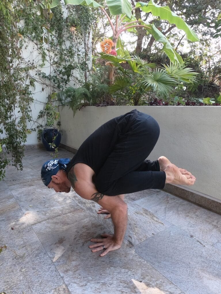 Crow Pose (Kakasana) Balcony Crow Pose (Kakasana) being performed on the balcony by Jai Salsbery at the Vallarta Breeze Yoga Puerto Vallarta Yoga Studio.