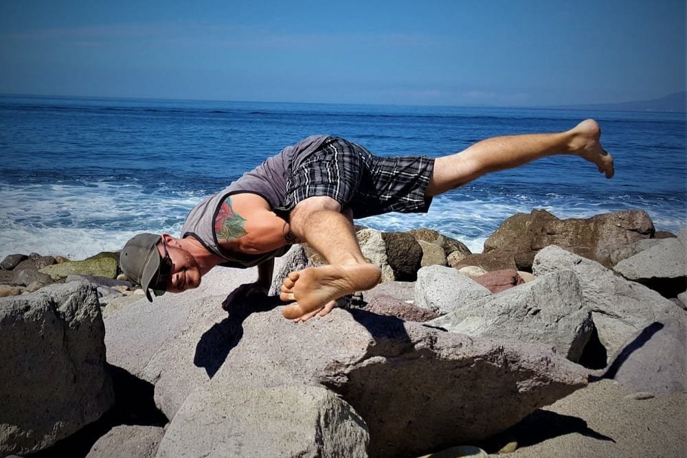 Eka Pada Koundinyasana II being performed by Yoga Teacher/Trainer Jai Salsbery E-Ryt500 at the Vallarta Breeze Yoga Puerto Vallarta Yoga Studio.
